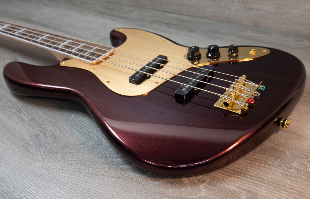 Squier 40th Anniversary Jazz Bass, edición Gold, diapasón de laurel, golpeador anodizado dorado, rojo rubí metalizado